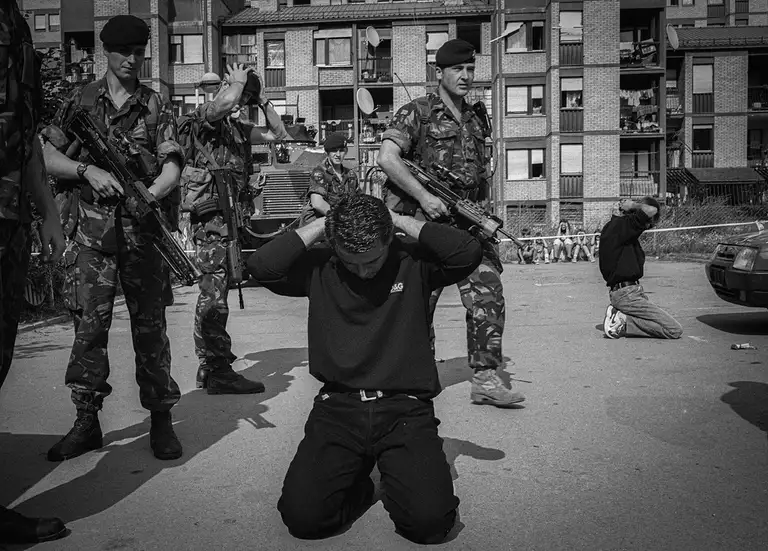 Detention and arrest of Pristina residents by NATO soldiers. Kosovo, June 1999. Photo by Oleg Klimov.