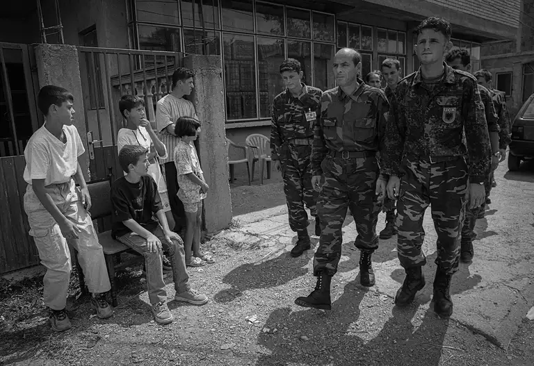 The soldiers of the Kosovo Liberation Army (KLA) that were active. While not a formal national army, Albanian forces were fighting against the Yugoslav Army in Kosovo in 1999, and the neighboring country of Albania deployed its army to its border with Kosovo in support. Pristina, Kosovo, June 1999.