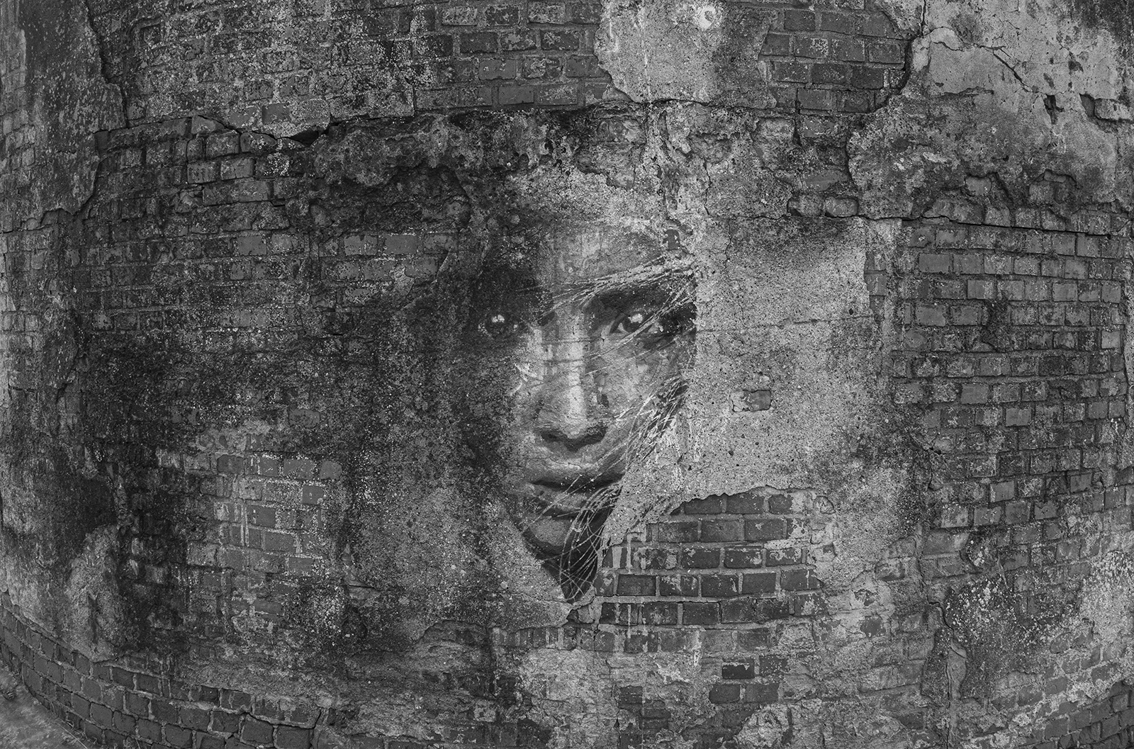 A face emerging from cracked brick. Memory survives even when architecture collapses. Kaliningrad region, 02.03.2026. Photo by Oleg Klimov