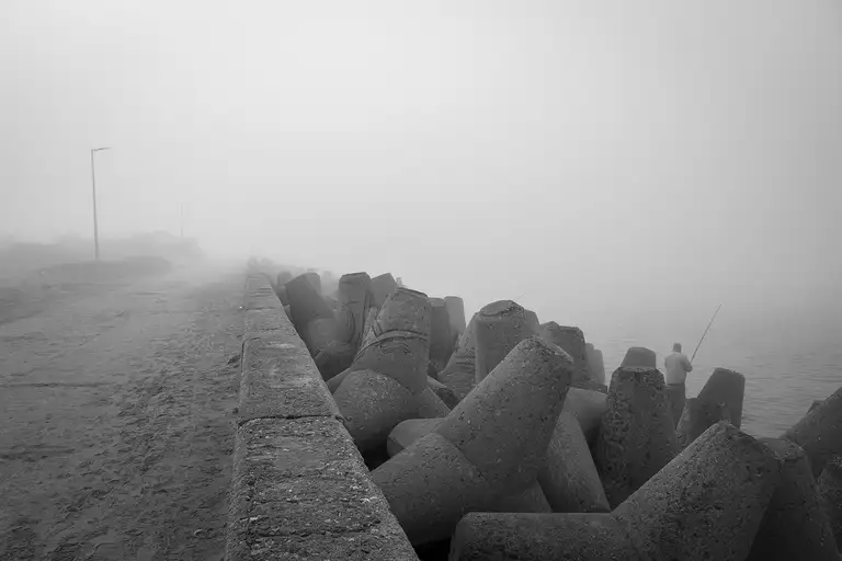 Tetrapods—massive reinforced concrete blocks shaped like four connected cones—are used to protect the shoreline from erosion and waves. Baltiysk, a Russian exclave. Photo by Oleg Klimov. April 2, 2026