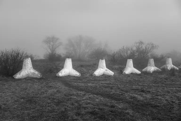 Tetrapods—massive reinforced concrete blocks shaped like four connected cones—are used to protect the shoreline from erosion and waves. Baltiysk, a Russian exclave. Photo by Oleg Klimov. April 2, 2026