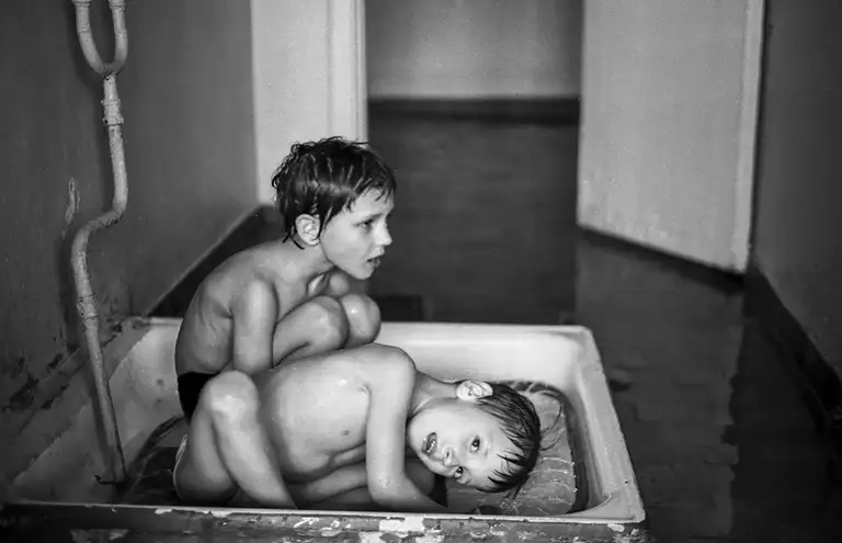 Bathing in a shower tray. Specialized Children's Home No. 2, which houses children with congenital malformations, postpartum injuries, and those who, according to doctors, cannot live among ordinary children. St. Michurina. Novokuznetsk. Kemerovo region. Kuzbass. Siberia. 29.05. 1981 Photo Vladimir Sokolaev/Liberty SU Archive